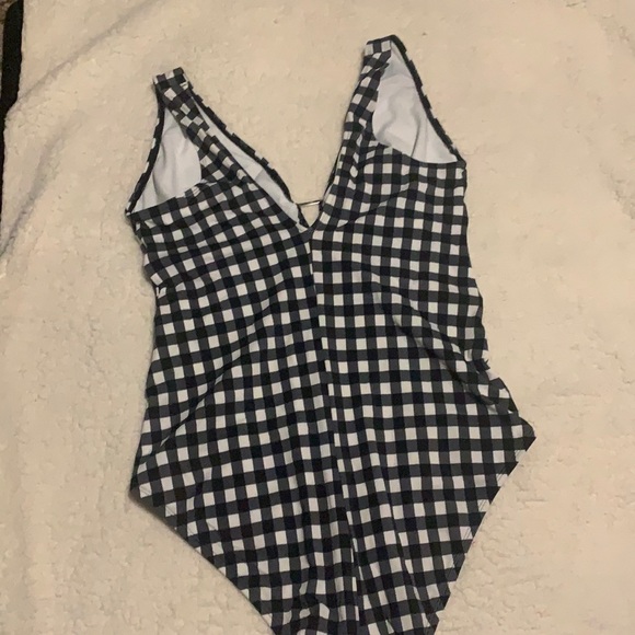 A one-piece bathing suit and low back and keyhole front. White and blue - Picture 2 of 3